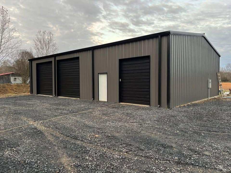 Finished Next Phase Inc metal building with roll-up doors
