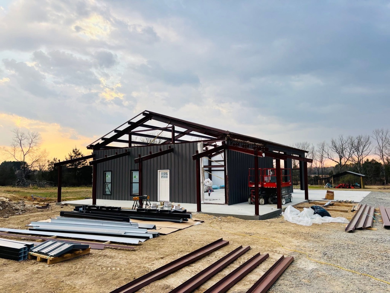 Steel frame building with wall sheeting going up