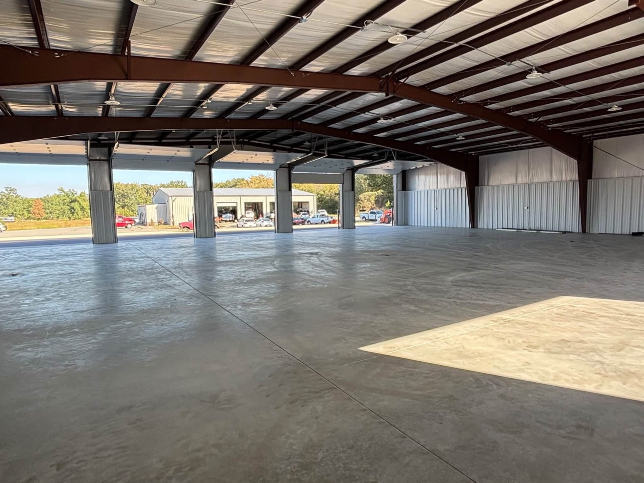 Finished interior with open bays and concrete floor