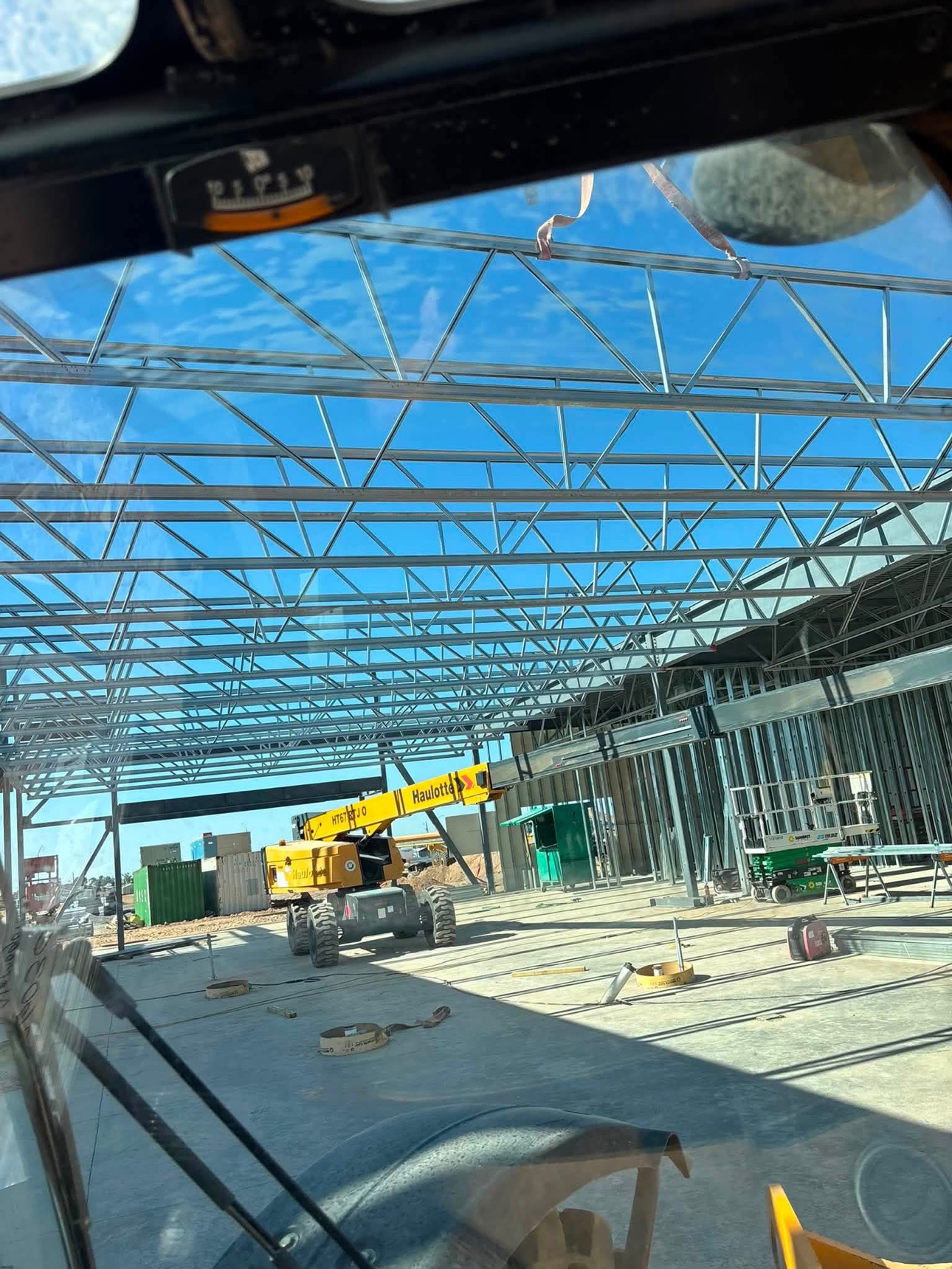 Roof trusses going up, viewed from a lift